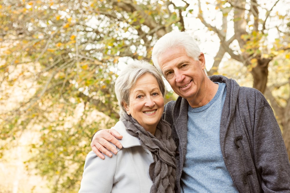 Senior couple in the park on an autumns day-1